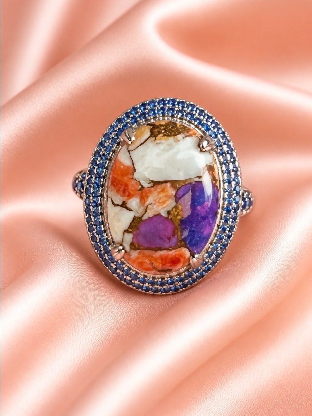 Blue Sapphires with a large Mojave Oyster Turquoise. Rhodium over 925 S.Silver.
